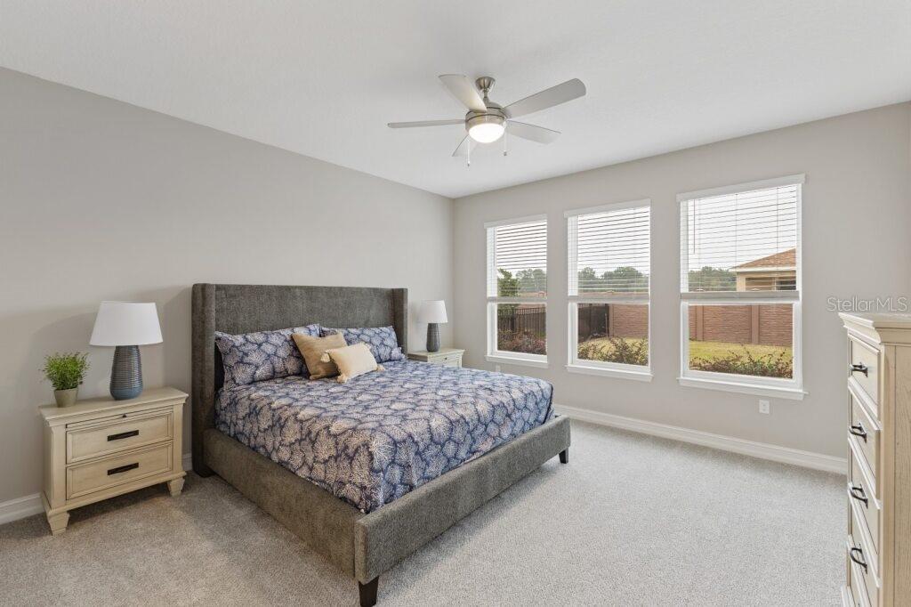 5567 Northwest 45th Lane Ocala, FL 34482 - Photo 13 of 21 a bedroom with a large bed and a window