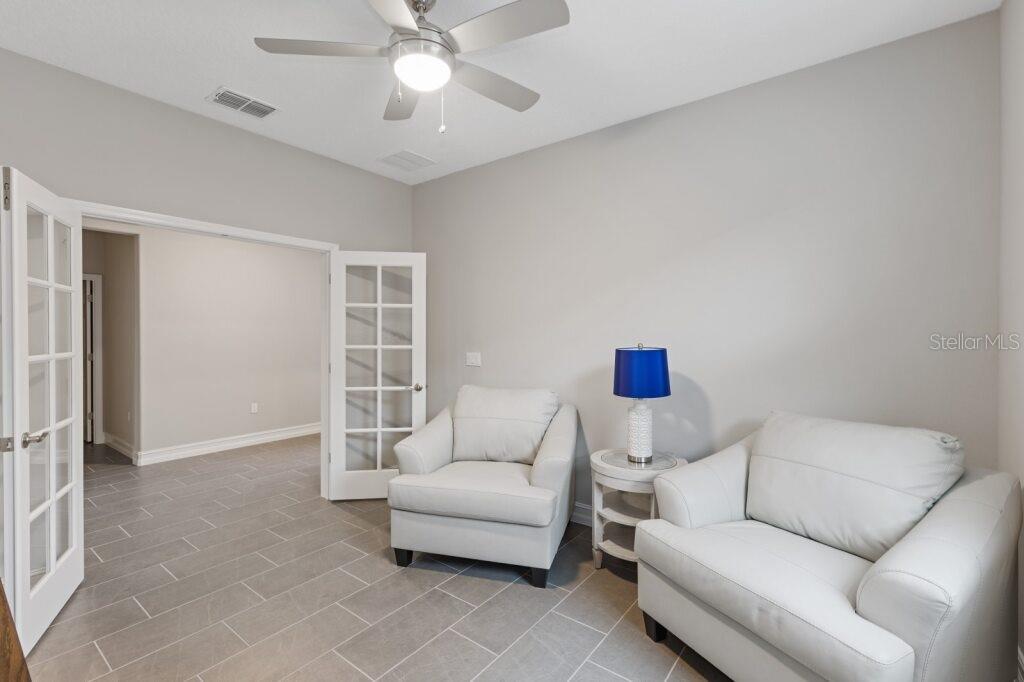 5567 Northwest 45th Lane Ocala, FL 34482 - Photo 2 of 21 a living room with furniture and a window
