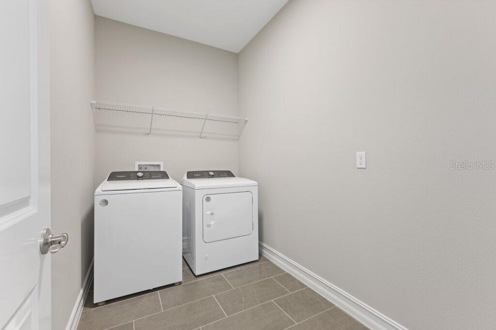 5567 Northwest 45th Lane Ocala, FL 34482 - Photo 21 of 21 a utility room with dryer and washer