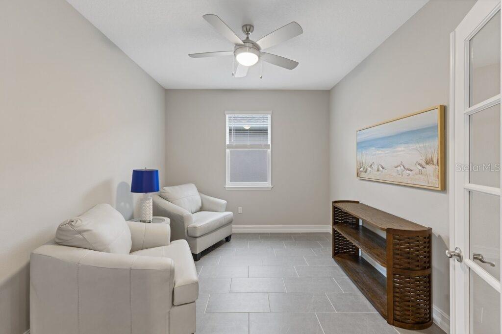 5567 Northwest 45th Lane Ocala, FL 34482 - Photo 3 of 21 a living room with furniture and a window