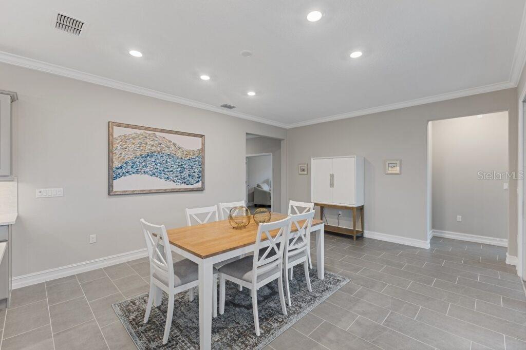 5567 Northwest 45th Lane Ocala, FL 34482 - Photo 9 of 21 a view of a dining room with furniture
