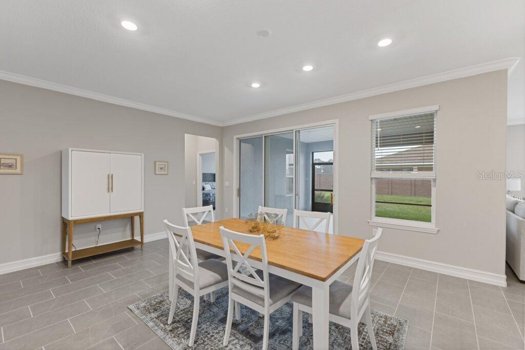 5567 Northwest 45th Lane Ocala, FL 34482 - Photo 10 of 21 a dining room with furniture and window