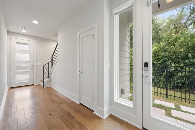 a view of room with wooden floor and cabinet
