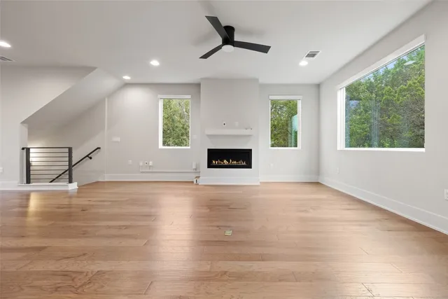 a view of a room window and wooden floor