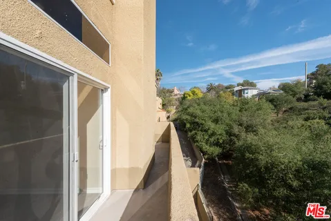 a view of a balcony with an outdoor space