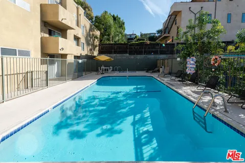 a view of swimming pool from a balcony