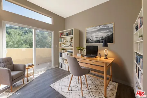 a workspace with furniture and a window