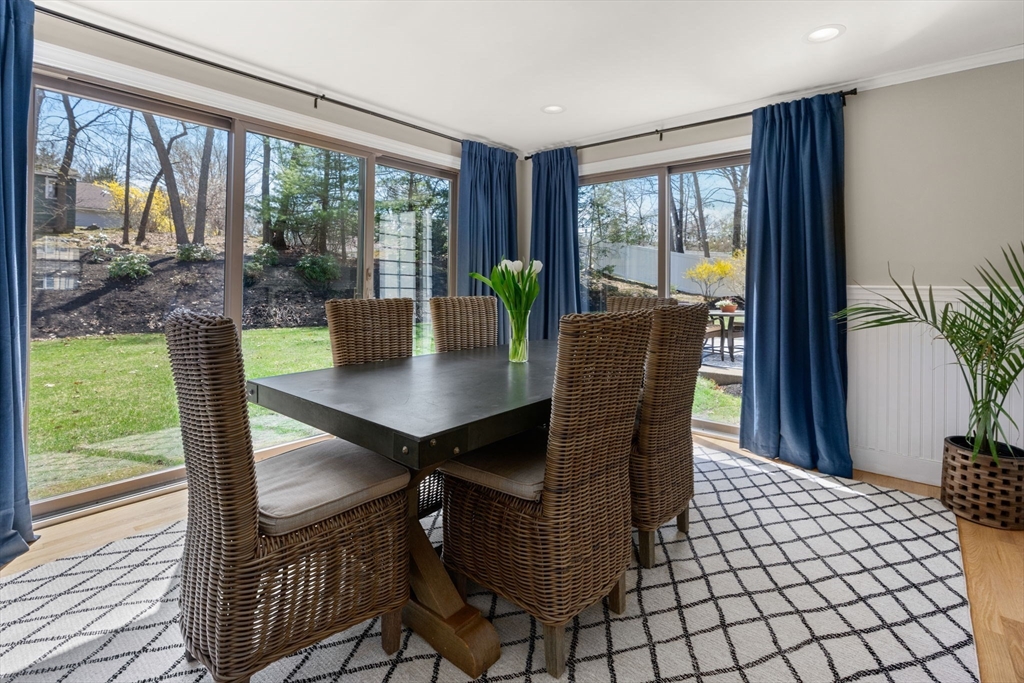 30 Ivy Road Wellesley, MA 02482 - Photo 14 of 34 a dining room with furniture wooden floor and a potted plant
