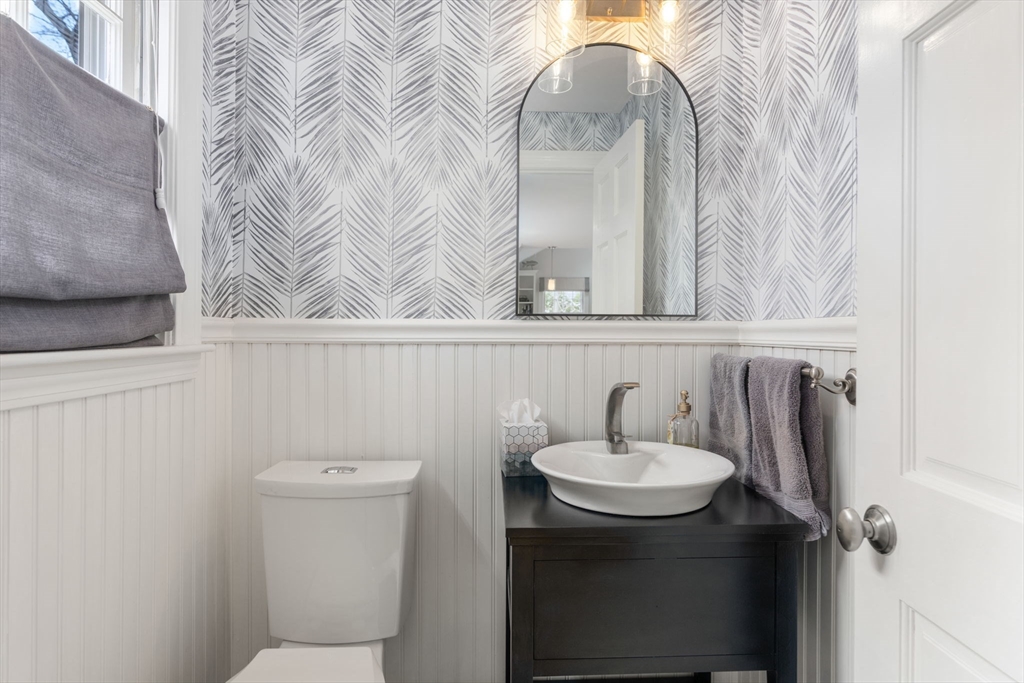 30 Ivy Road Wellesley, MA 02482 - Photo 15 of 34 a bathroom with a sink a toilet and mirror