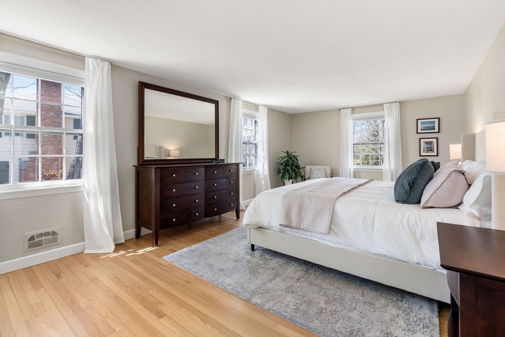 30 Ivy Road Wellesley, MA 02482 - Photo 17 of 34 a bedroom with a bed and a tv on dresser