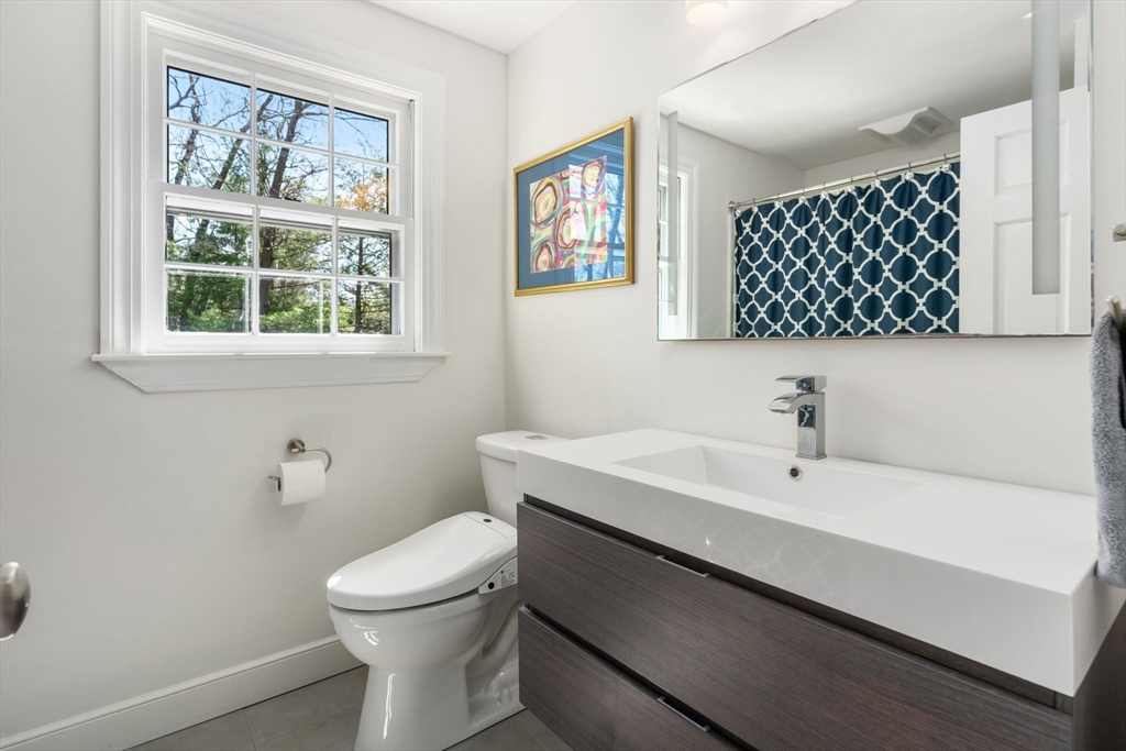 30 Ivy Road Wellesley, MA 02482 - Photo 22 of 34 a bathroom with a sink a toilet and a window