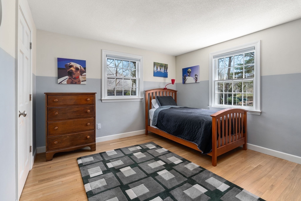 30 Ivy Road Wellesley, MA 02482 - Photo 23 of 34 a bedroom with a bed and a window