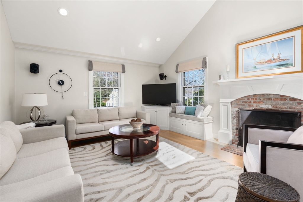 30 Ivy Road Wellesley, MA 02482 - Photo 3 of 34 a living room with furniture a flat screen tv and a fireplace
