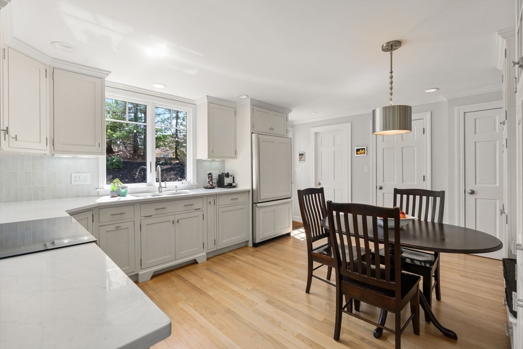 30 Ivy Road Wellesley, MA 02482 - Photo 7 of 34 a kitchen that has a table chairs in it and wooden floors