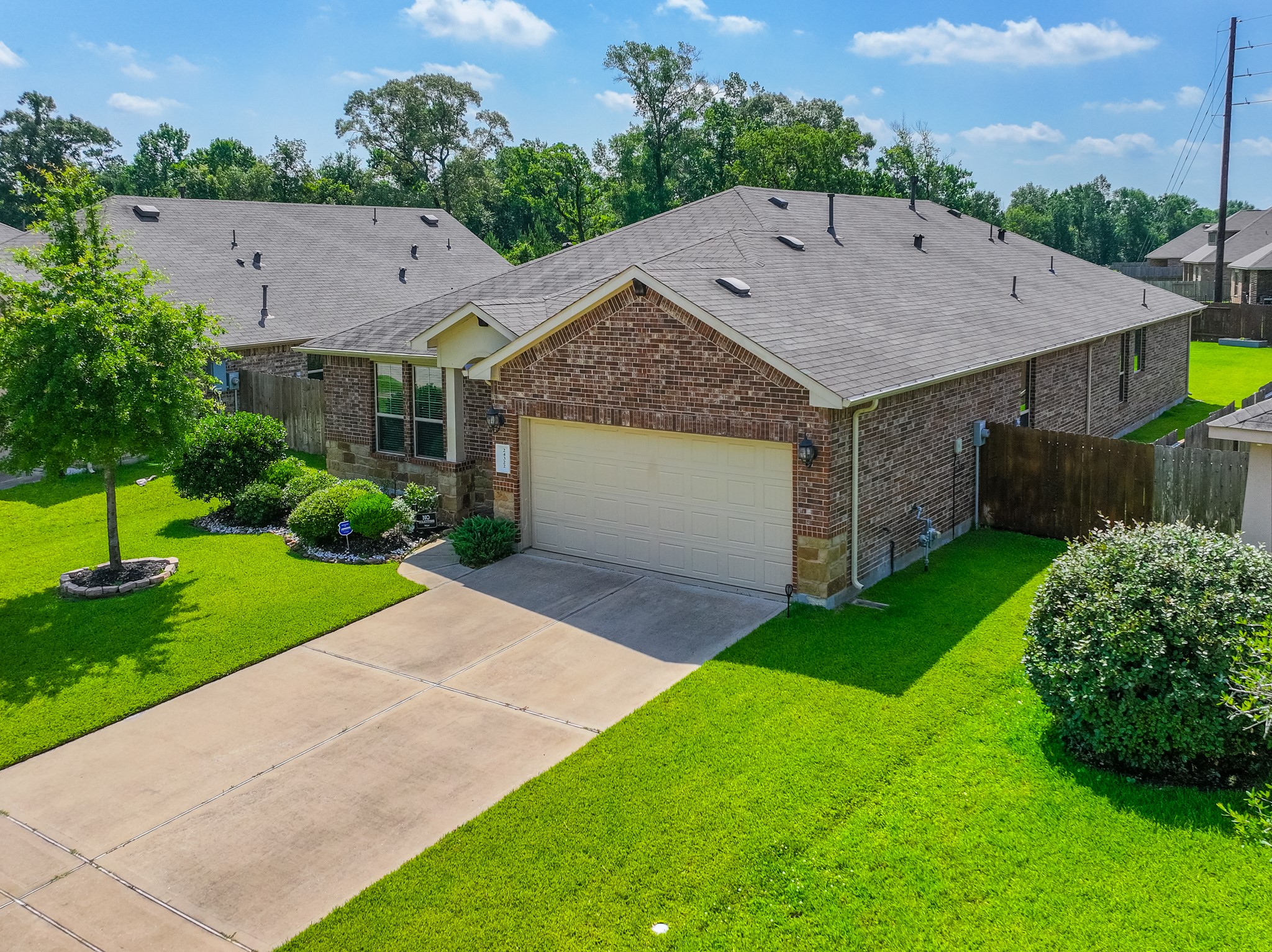 24322 North Newcastle Bay Trail Spring, TX 77389 - Photo 4 of 50 a aerial view of a house with a yard and a garage