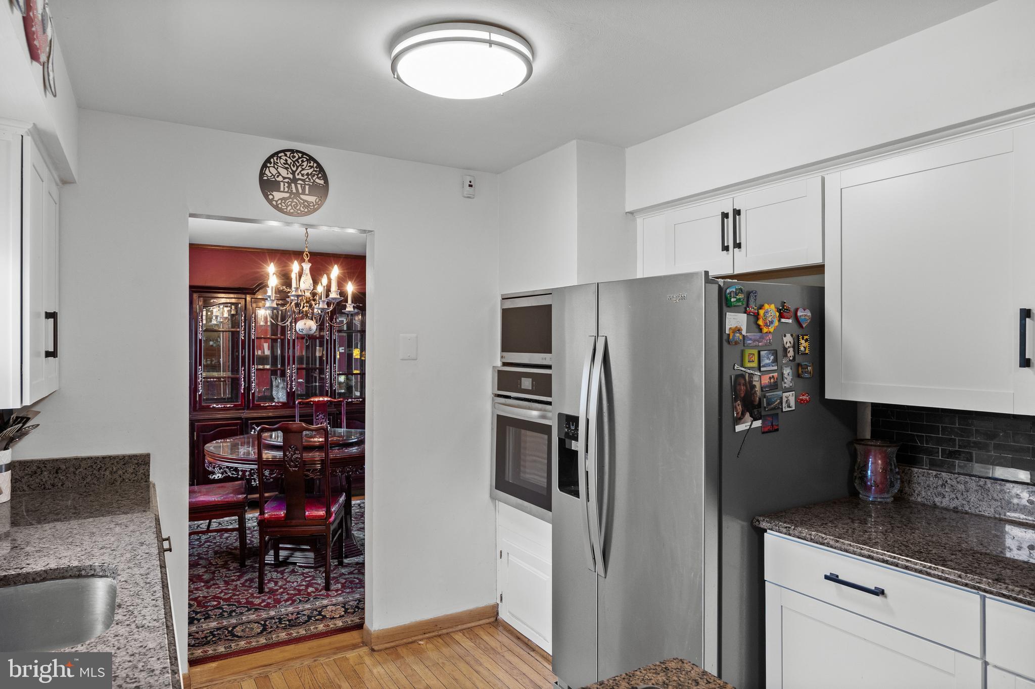 13 Rutgers Drive Delran, NJ 08075 - Photo 11 of 38 a view of a kitchen with fridge and wooden floor