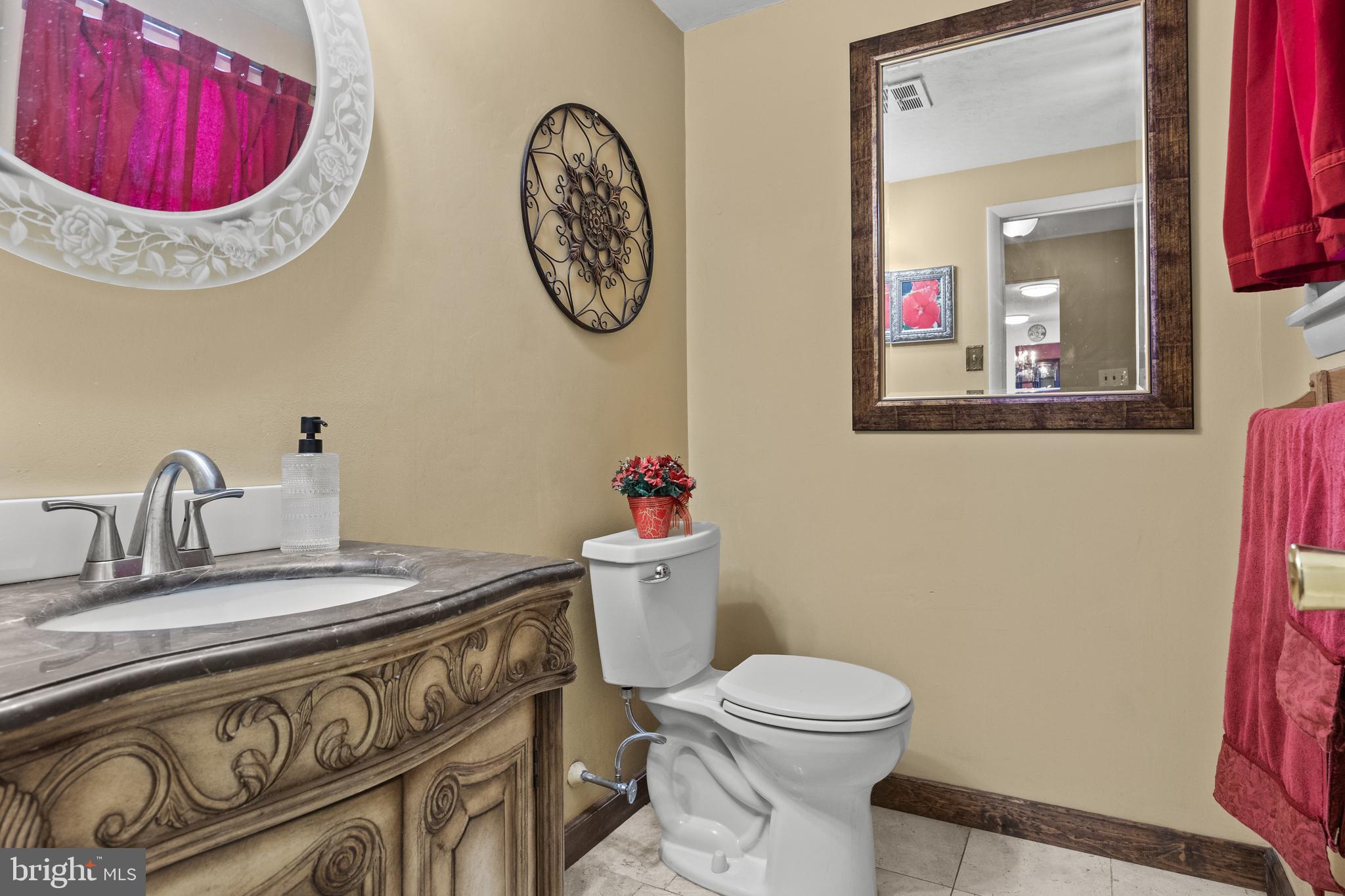 13 Rutgers Drive Delran, NJ 08075 - Photo 16 of 38 a bathroom with a toilet a sink and mirror