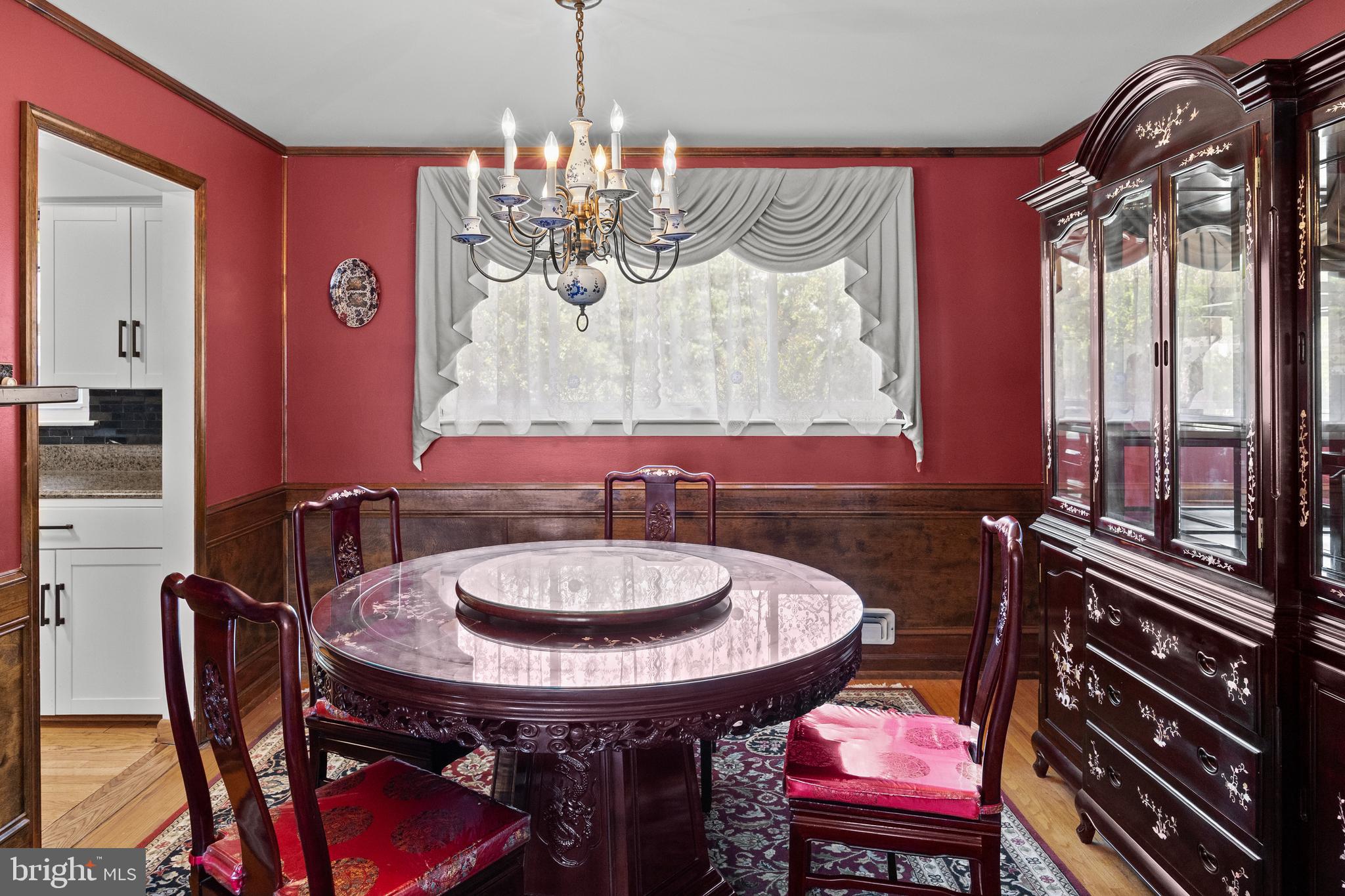 13 Rutgers Drive Delran, NJ 08075 - Photo 19 of 38 a dining room with a table chairs and a chandelier