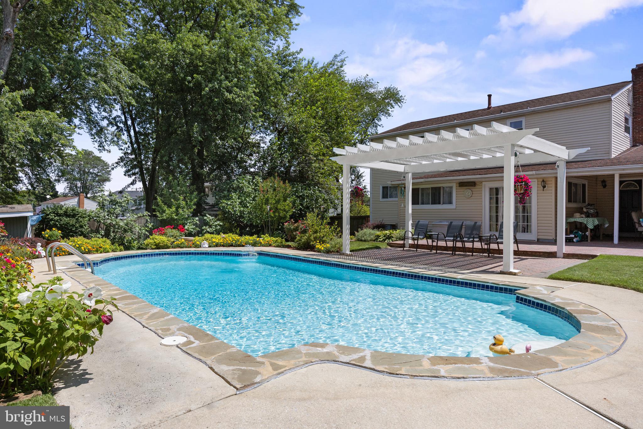 13 Rutgers Drive Delran, NJ 08075 - Photo 32 of 38 a view of a swimming pool with chairs