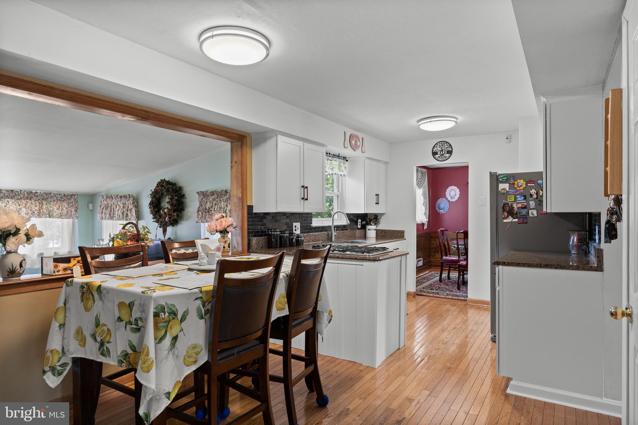 13 Rutgers Drive Delran, NJ 08075 - Photo 7 of 38 a dining room with furniture and wooden floor