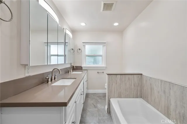 a bathroom with a sink and a bathtub