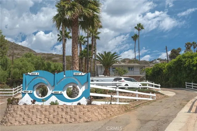 a view of a house with swimming pool and porch with furniture