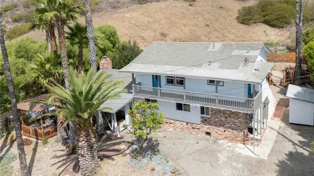 a view of a house with a tree
