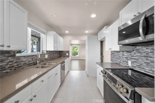 a kitchen with a stove and a sink