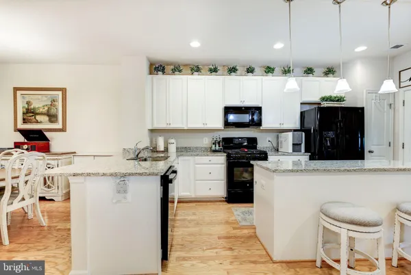a kitchen with a sink cabinets and stainless steel appliances