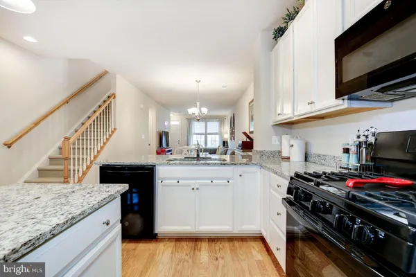 a kitchen with a refrigerator a sink and dishwasher