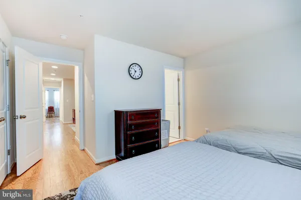 a bedroom with two beds and a window