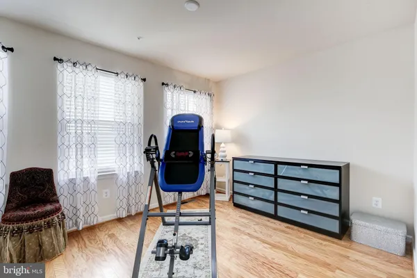 a view of washer and dryer with bathroom in the background