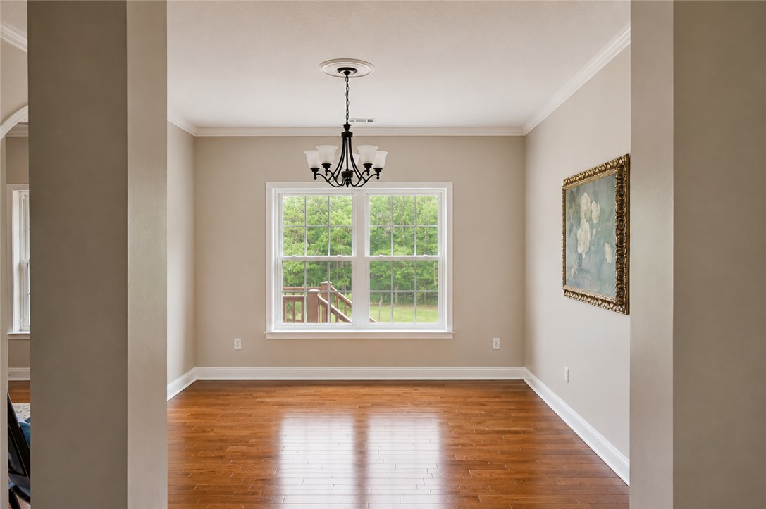 190 Fred Bradford Road Iva, SC 29655 - Photo 7 of 32 This bright space offers rich hardwood floors and elegant crown molding.