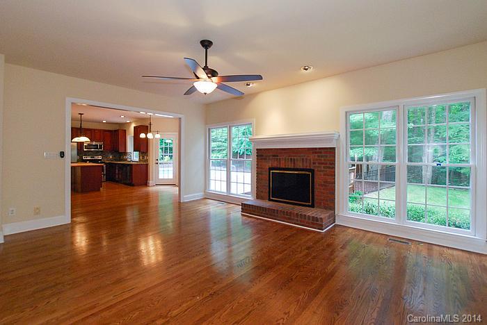 7131 Forest Ridge Road Weddington, NC 28104 - Photo 13 of 23 wooden floor fireplace and windows in an empty room