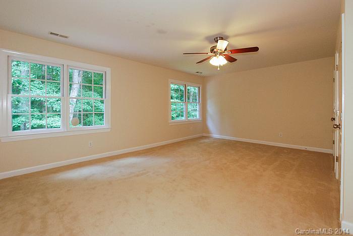 7131 Forest Ridge Road Weddington, NC 28104 - Photo 19 of 23 a view of empty room with window and ceiling fan