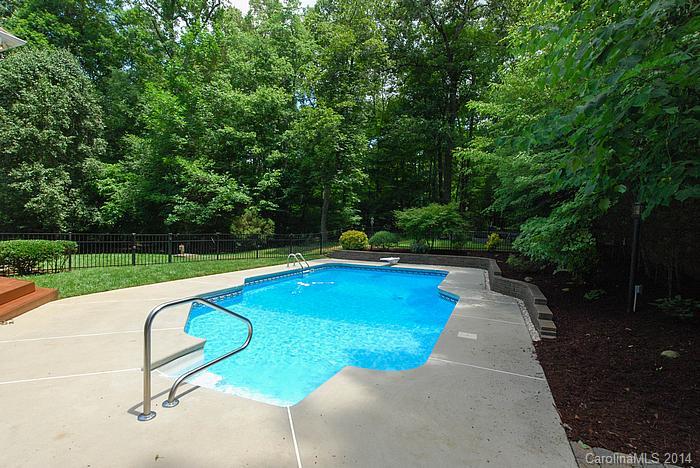 7131 Forest Ridge Road Weddington, NC 28104 - Photo 3 of 23 a view of a swimming pool with a patio and a backyard