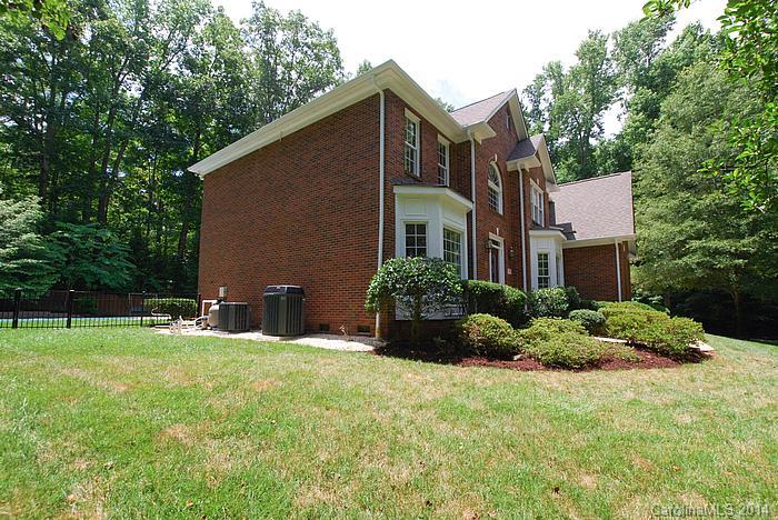 7131 Forest Ridge Road Weddington, NC 28104 - Photo 21 of 23 a backyard of a house with lots of green space