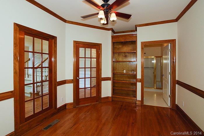 7131 Forest Ridge Road Weddington, NC 28104 - Photo 6 of 23 wooden floor in an empty room with a window