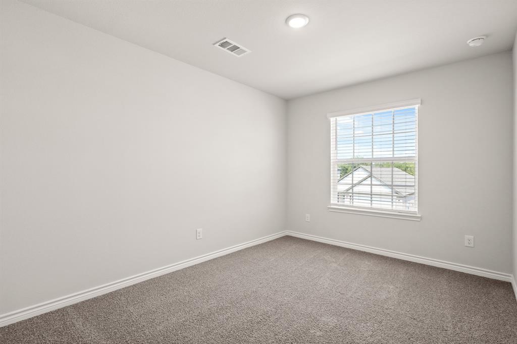 1511 Romans Road Ennis, TX 75119 - Photo 13 of 22 an empty room with a window