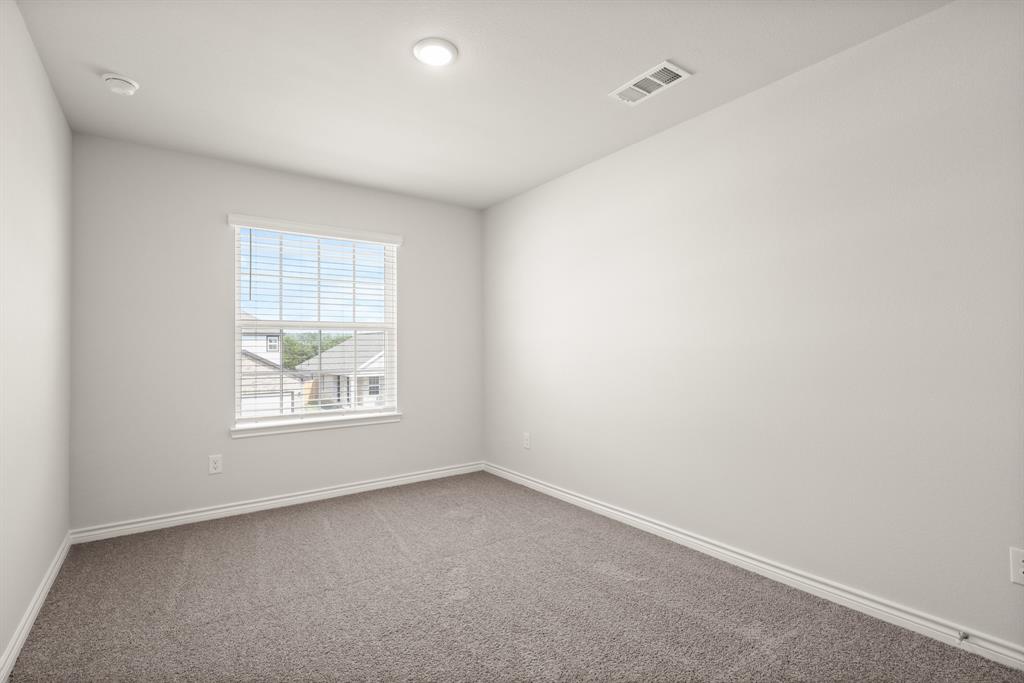 1511 Romans Road Ennis, TX 75119 - Photo 16 of 22 an empty room with a window