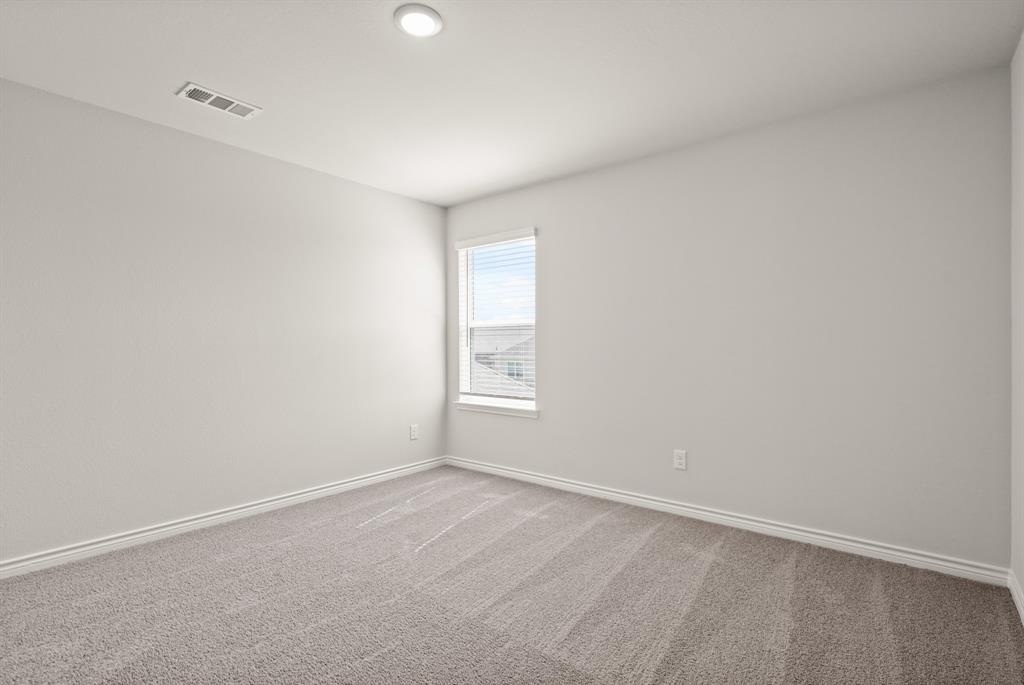 1511 Romans Road Ennis, TX 75119 - Photo 18 of 22 a view of an empty room with a window