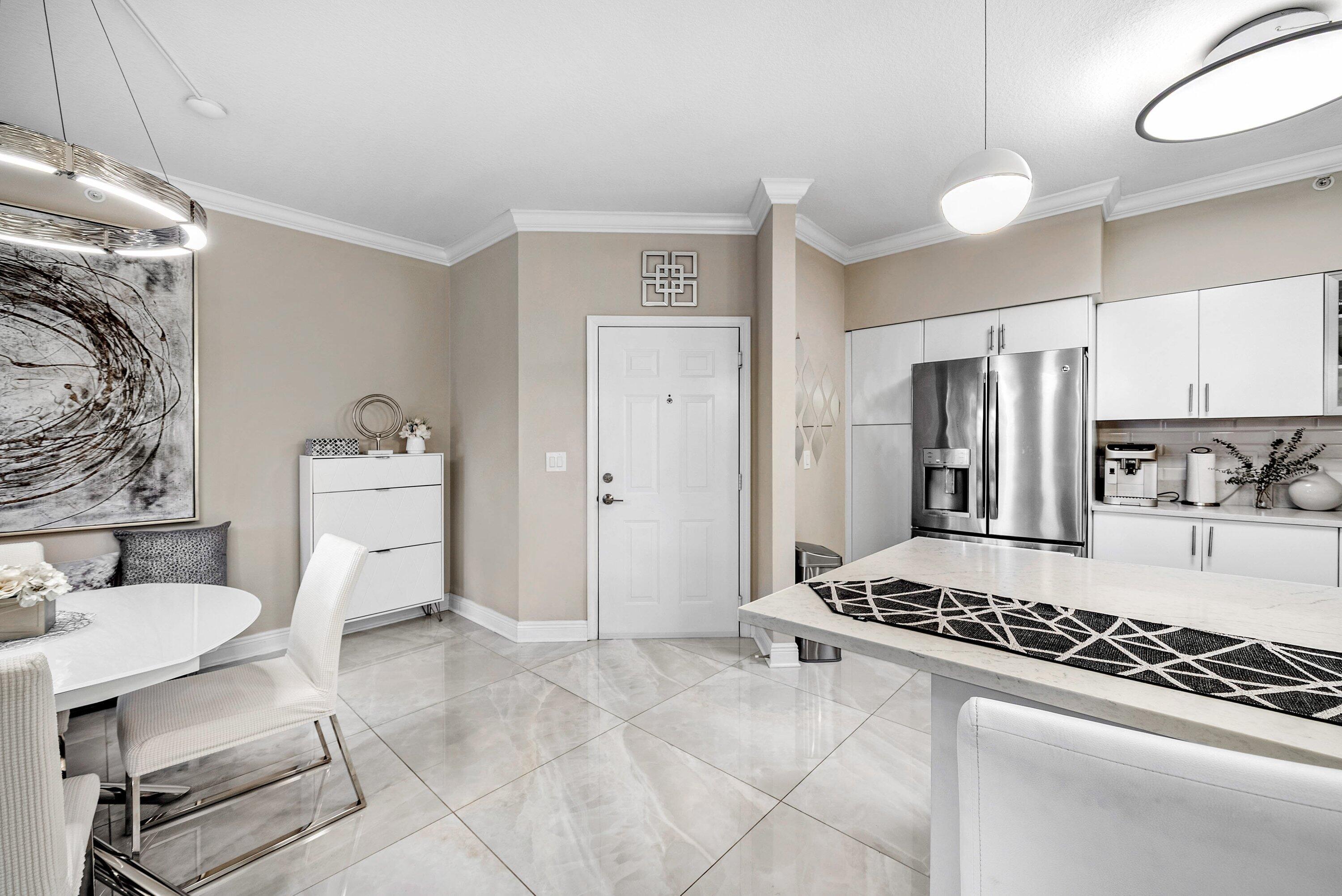 233 South Federal Highway, Unit 509 Boca Raton, FL 33432 - Photo 13 of 49 a kitchen with stainless steel appliances granite countertop a stove and a refrigerator