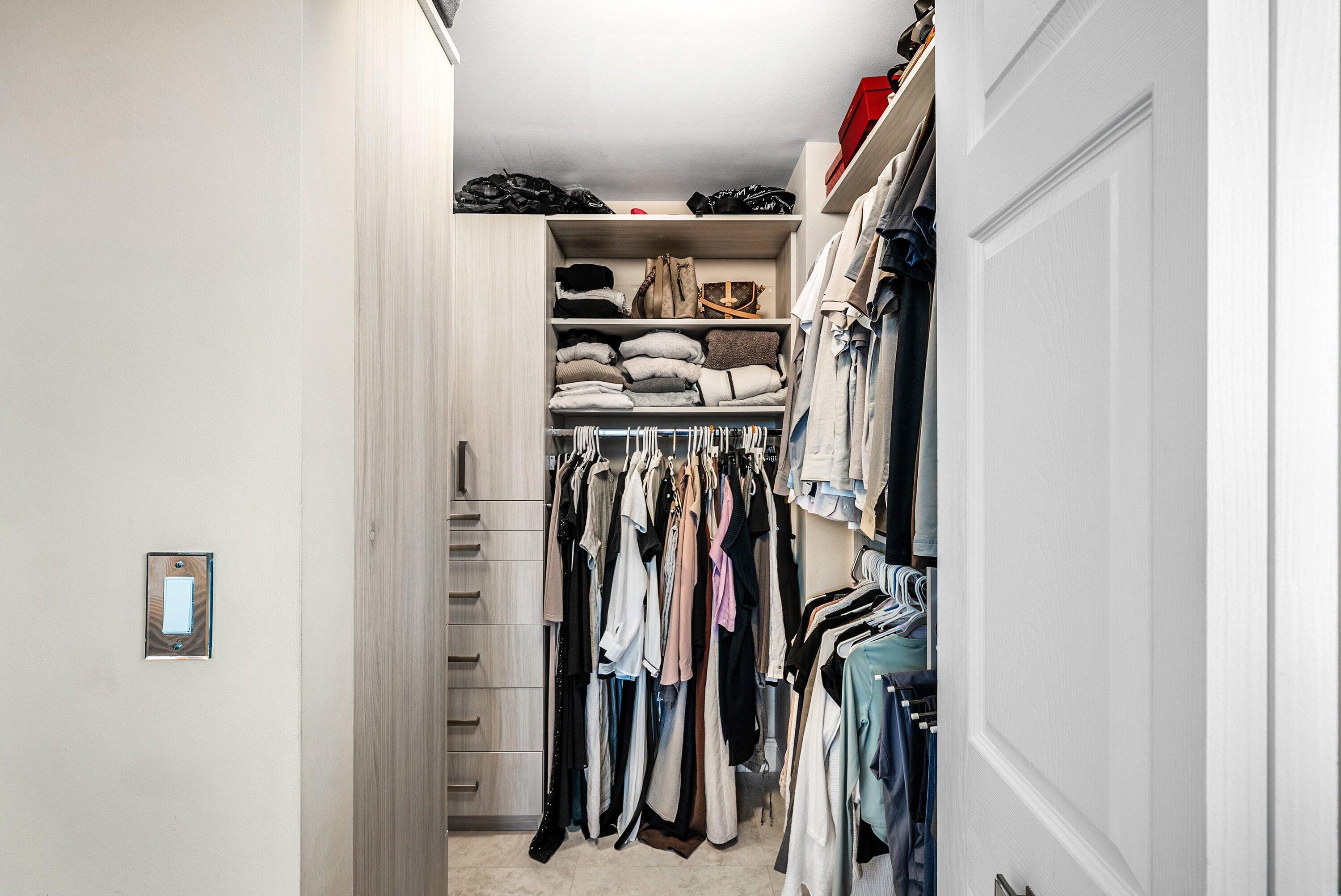 233 South Federal Highway, Unit 509 Boca Raton, FL 33432 - Photo 16 of 49 a view of walk in closet with clothes