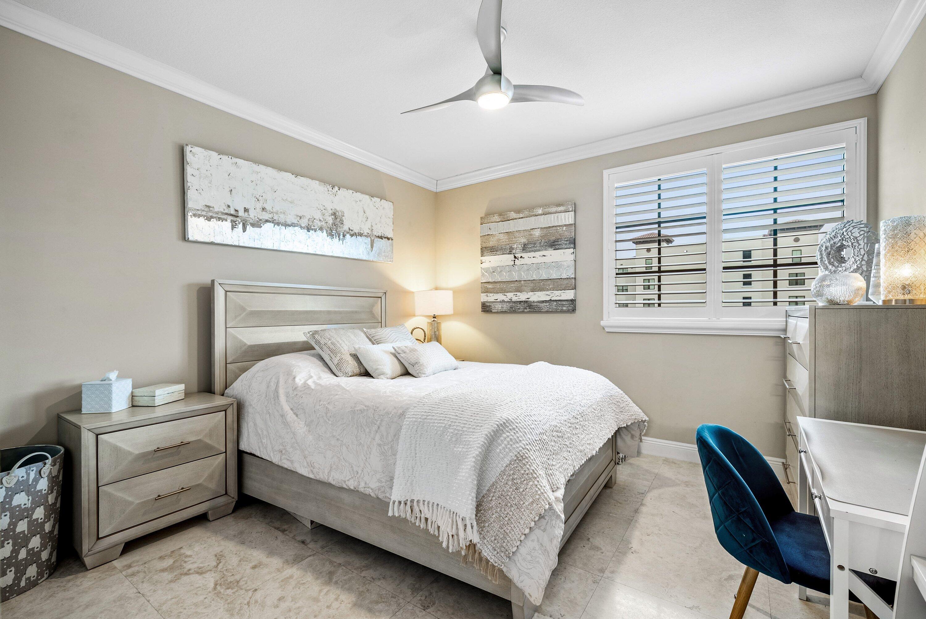 233 South Federal Highway, Unit 509 Boca Raton, FL 33432 - Photo 22 of 49 a bedroom with a large bed and a chair