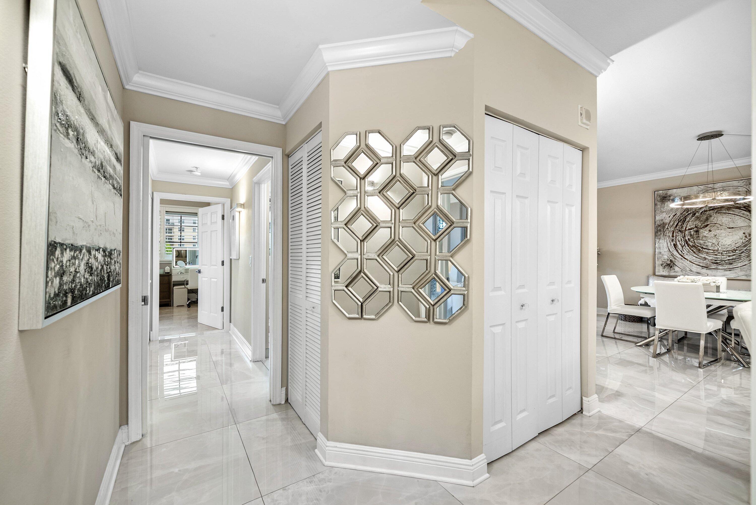 233 South Federal Highway, Unit 509 Boca Raton, FL 33432 - Photo 26 of 49 a view of a hallway with bathroom and wooden floor