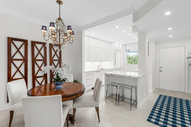 a kitchen with a sink window and cabinets