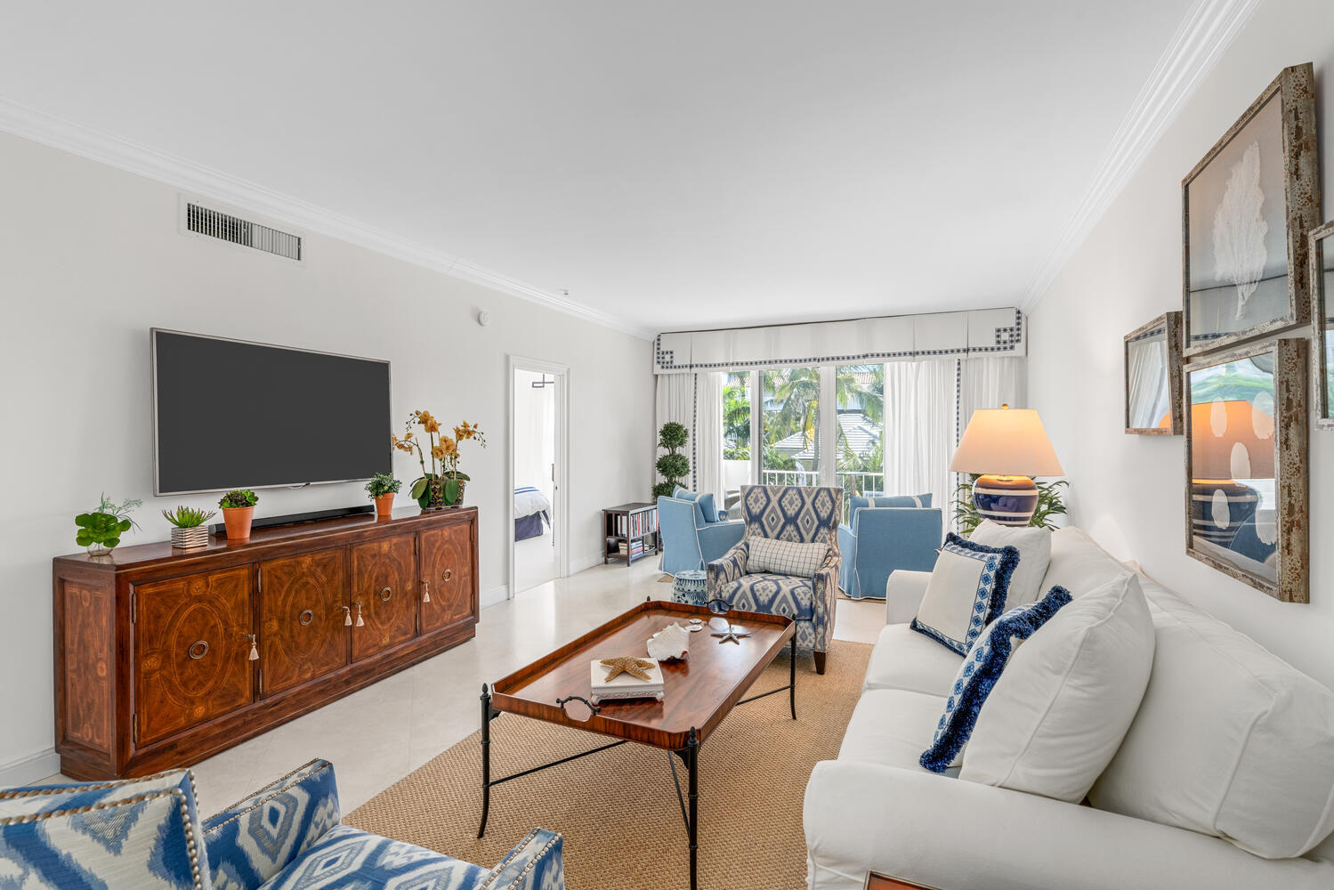 127 Peruvian Avenue, Unit 302 Palm Beach, FL 33480 - Photo 21 of 52 a living room with furniture and a flat screen tv