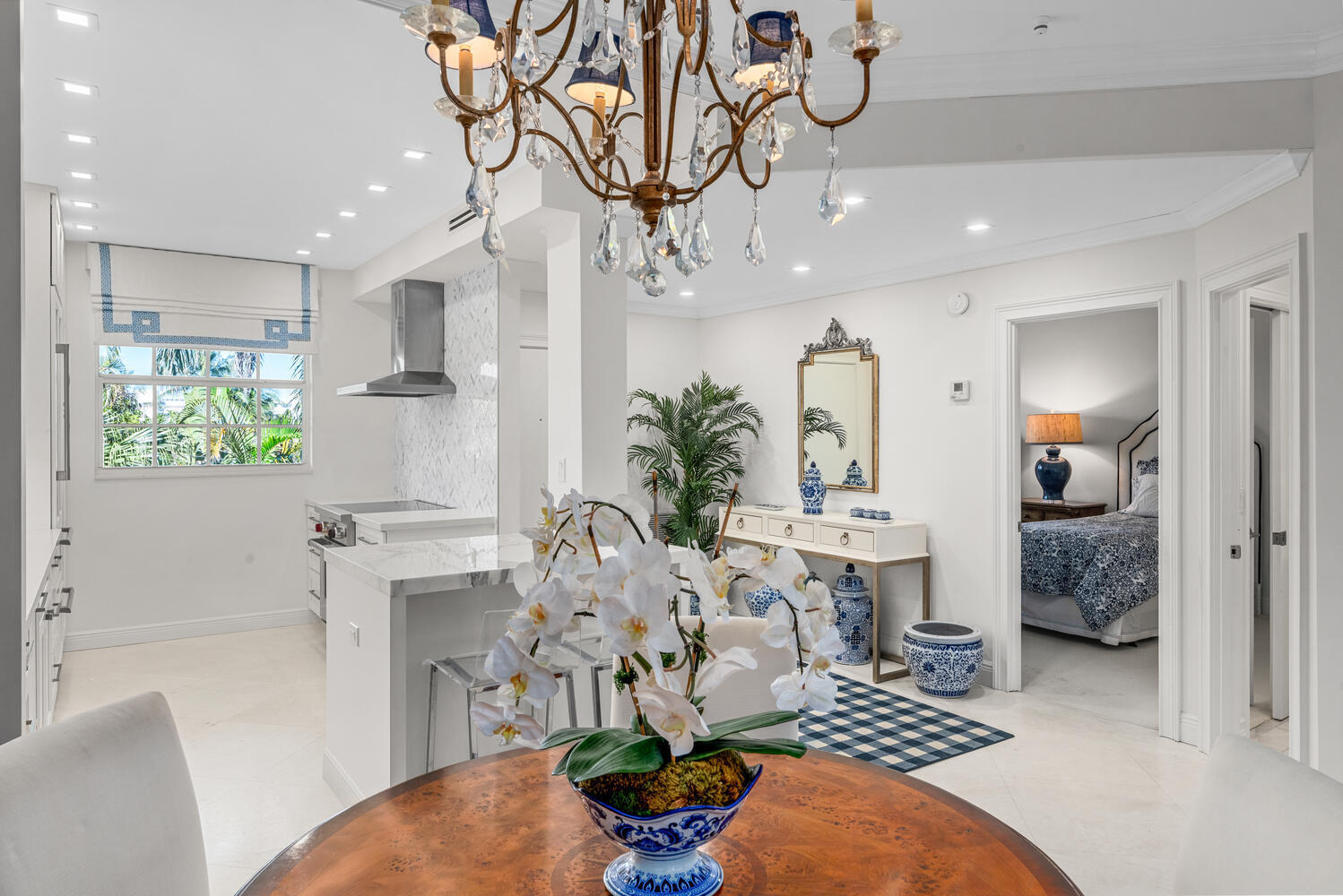 127 Peruvian Avenue, Unit 302 Palm Beach, FL 33480 - Photo 22 of 52 a living room with furniture a chandelier and a rug