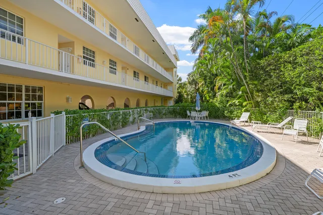 a view of a swimming pool with a patio