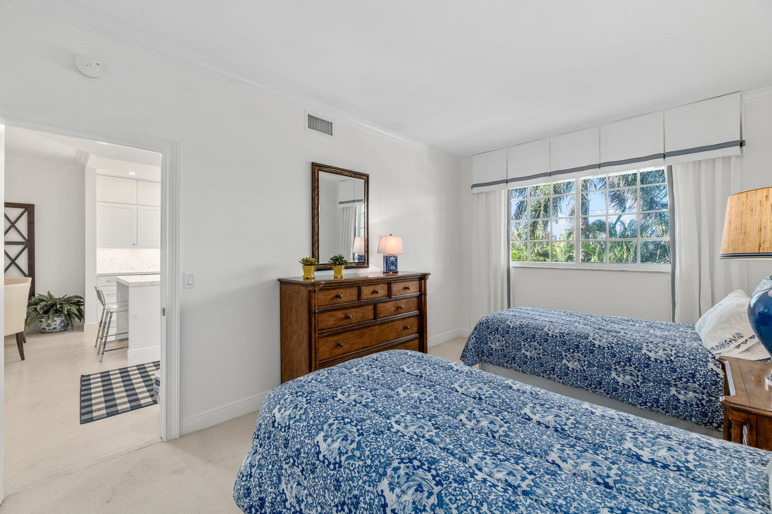 127 Peruvian Avenue, Unit 302 Palm Beach, FL 33480 - Photo 34 of 52 a bedroom with a bed and wooden floor
